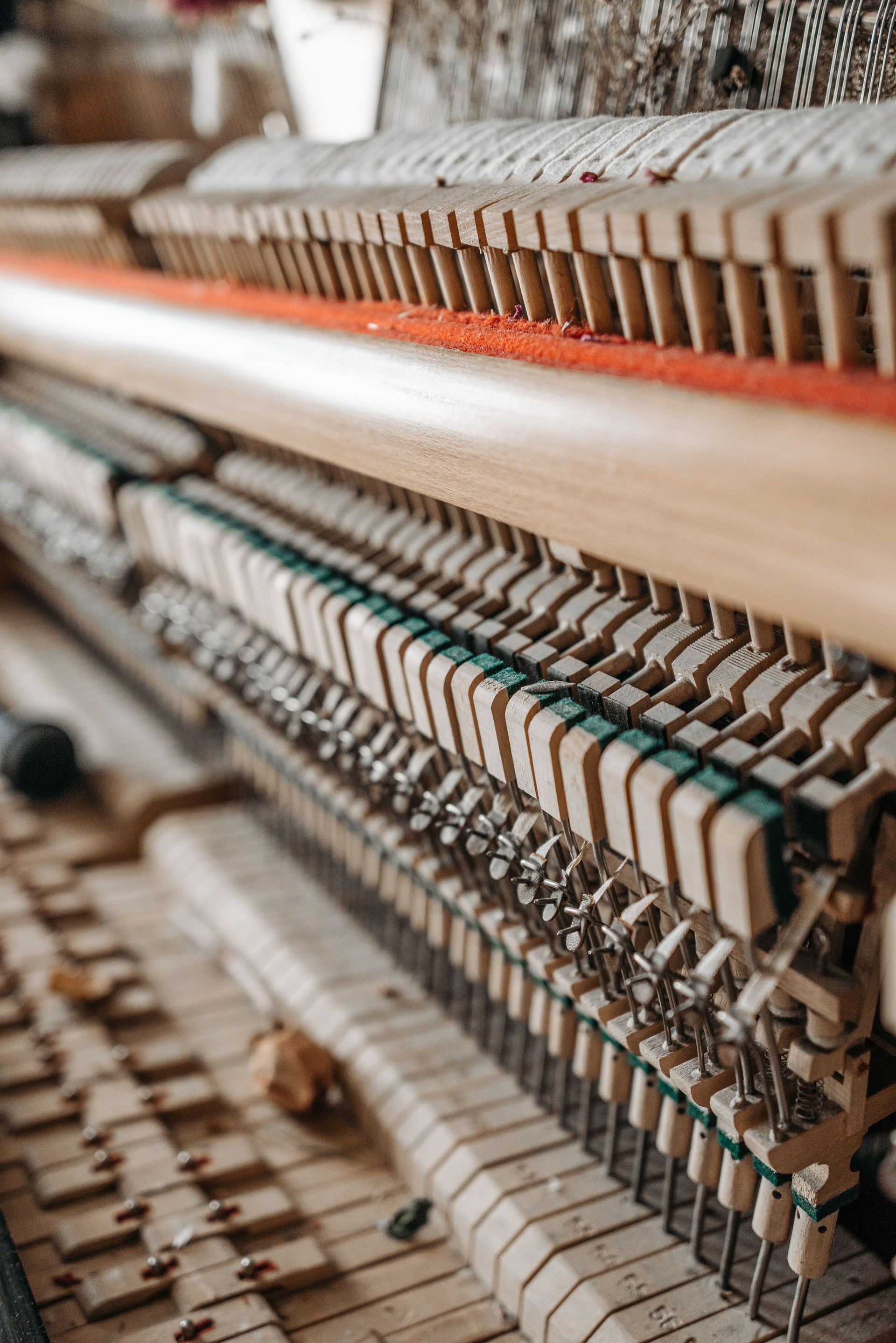 Detailed view of a piano's internal hammers and strings. Ideal for music enthusiasts.